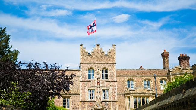 Image of Jesus College Gate Tower with flag